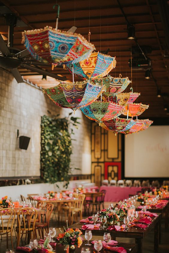 colorful Indian dinner setup with hanging umbrellas